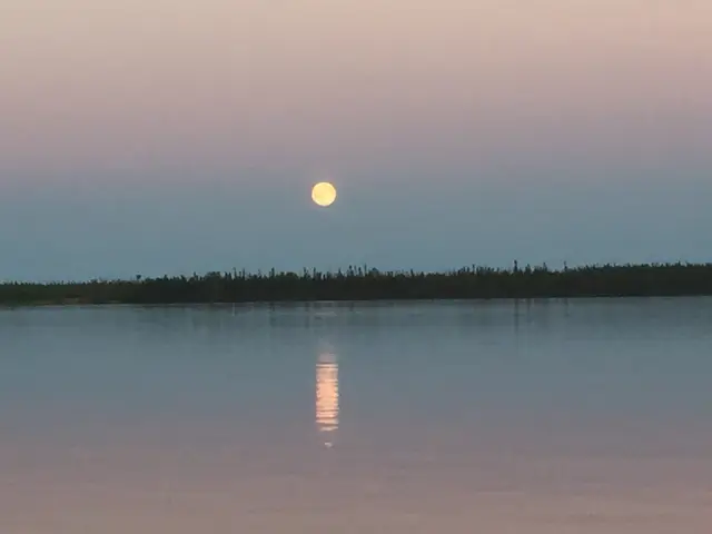 Moon rising over Wollaston Lake